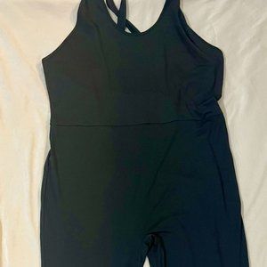 Plus Size Black Jumpsuit with a small diagonal mesh design beneath the calf area